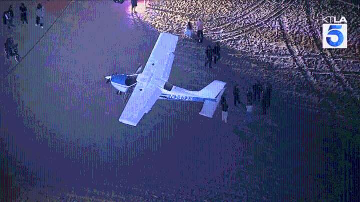 Pilot lands plane on Huntington Beach sand after engine failure