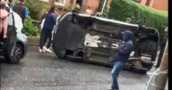 Car flips on Glasgow street as members of the public rush to rescue driver