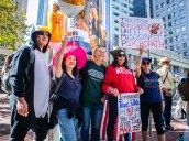 Defiance and solidarity fill the streets as thousands protest Trump