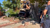 2 hospitalized, 1 detained after car crashes into North Hollywood residence