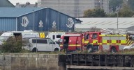 Coastguard and lifeboat crews rescue injured person after fall at docks