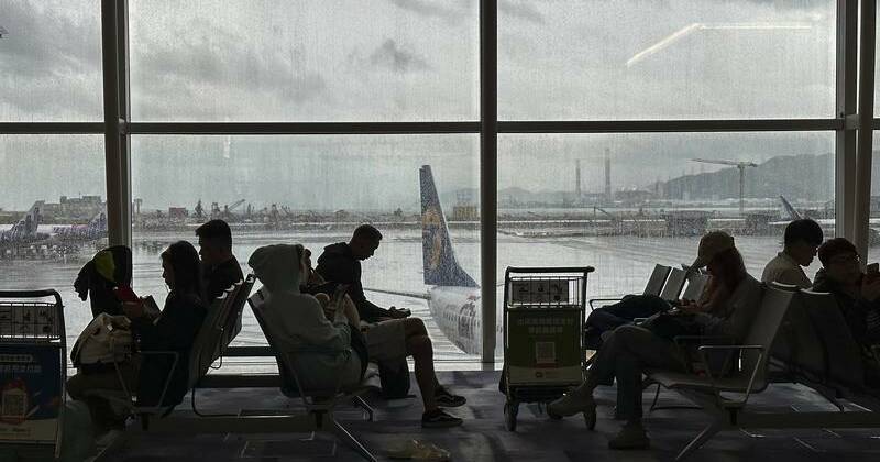 Cargo plane slides off runway in Hong Kong