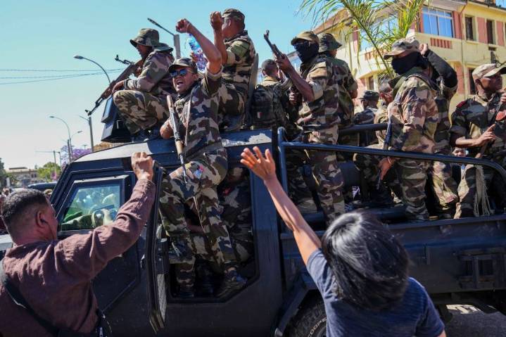 Madagascar president has left the country after soldiers turned against him, lawmaker says