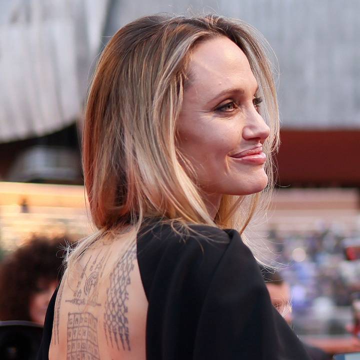 Angelina Jolie Lets Her Back Tattoos Shine at Italy Film Premiere