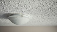Before Skim Coating Your Old Popcorn Ceiling, Watch Out For These Sneaky Drawbacks