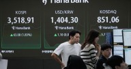 Asian shares are mostly lower following Wall Street's pause from its feverish rally