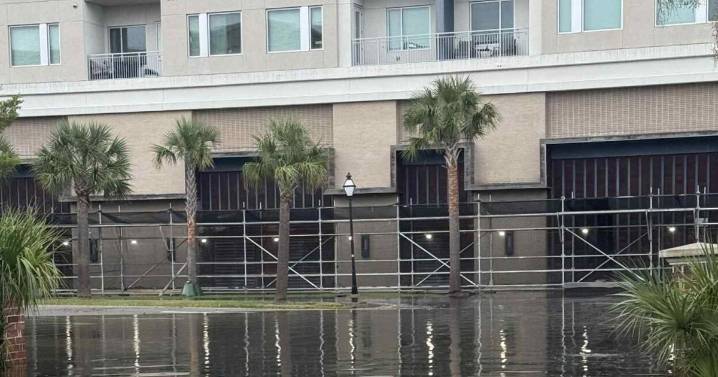 Diver goes for a swim in downtown Charleston flood waters