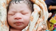Baby born on platform fighting for his life