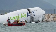 Cargo aircraft skids off Hong Kong airport runway into sea, 2 dead