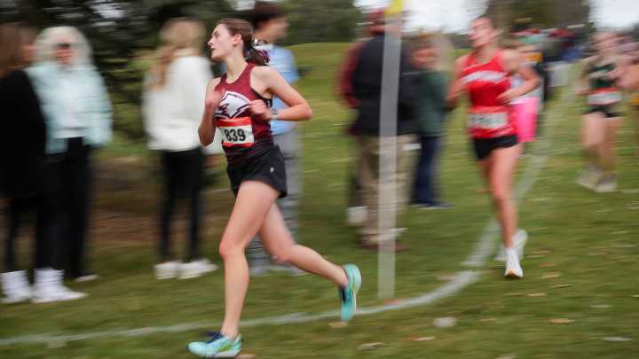 Photos of girls running at the WIAA Cross Country D1/D3 Sectionals