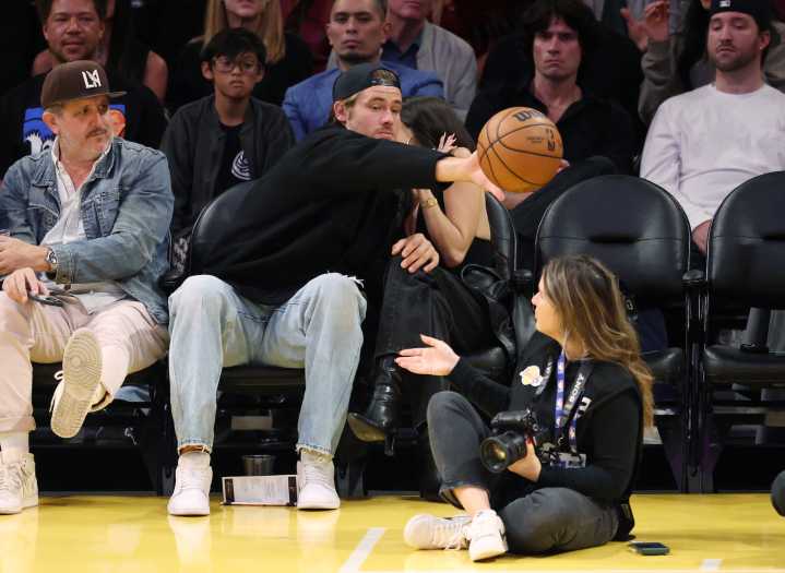 Chargers' Justin Herbert Saves Girlfriend Madison Beer From Ball at NBA Game