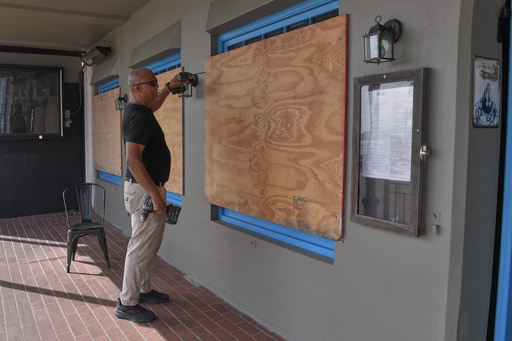Imelda descends on Bermuda as Category 2 hurricane with damaging wind and waves