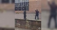 The moment bloodied synagogue attacker approached face down on floor
