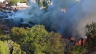 Drone video shows crews battling massive Alabama fire