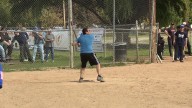 County and city employees face off in a softball game for charity