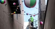 Downtown Spokane swaps summer beachballs with fall-themed decor in alley near Riverside Avenue