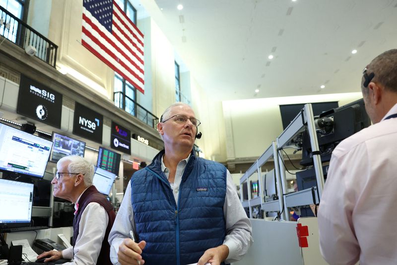 Stocks boosted by rate outlook; gold hits record $4,000