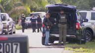 Police: 1 of 2 officers shot by friendly fire outside West Palm Beach home during shootout with suspect