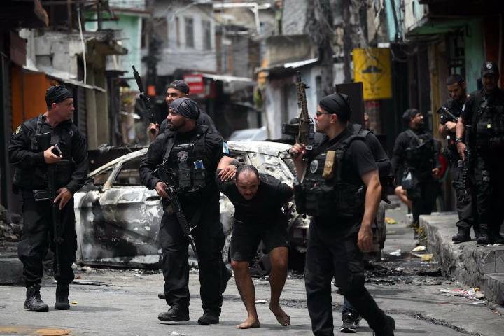 At least 60 people die in massive police raid in Rio de Janeiro, official says
