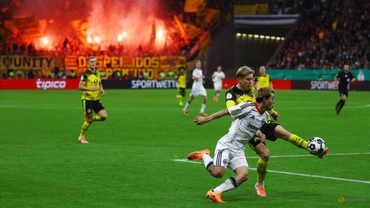 Dortmund advance in German Cup after shootout win at Frankfurt