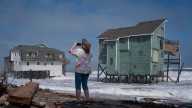 New Jersey declares emergency as nor'easter approaches, while Alaska flooding carries away homes