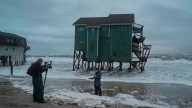 New Jersey declares emergency as nor'easter approaches, while Alaska flooding carries away homes