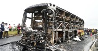 Luxury coach erupts in flames after motorbike crash with passengers 'burning alive'