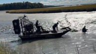Duck hunter rescued after becoming stuck waist