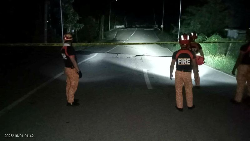 Philippines quake death toll rises to 69 , official says