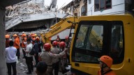 At least 91 students remain buried in rubble 2 days after school collapse in Indonesia
