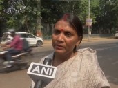 RJD worker Usha Devi protests outside Lalu Yadav's residence