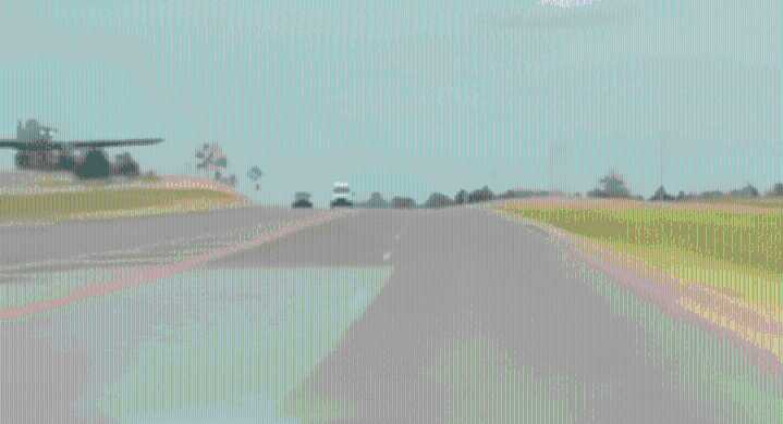 Tesla dashcam captures military plane crash-landing in Oklahoma, narrowly missing car; social media calls it ‘AI