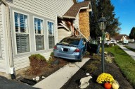Car slams into multi-family home, driver hospitalized after crash in Weathersfield Drive neighborhood