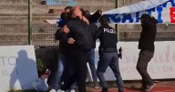 Police forced to intervene as club president brawls with fans over banner