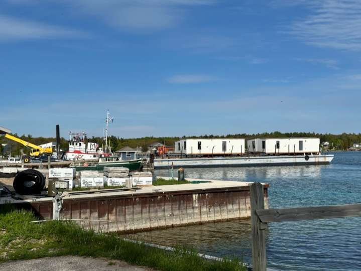 Homes shipped 30 miles across Lake Michigan to help remote island’s housing crisis