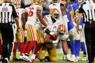 Battered 49ers fight and claw past Rams with game