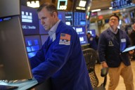 Most US stocks rise after swinging through another erratic day