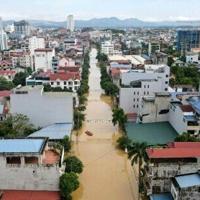 Record flooding hits Vietnam city, eight killed in north
