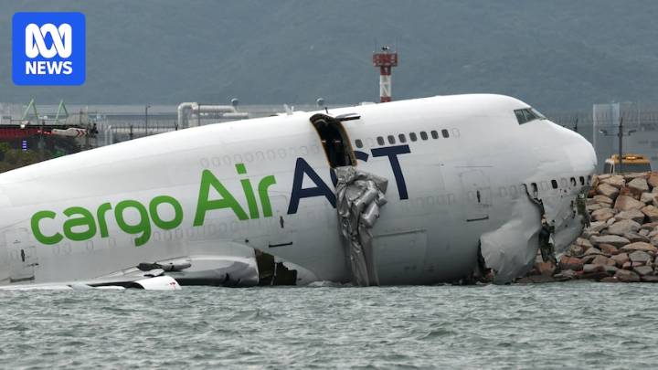 Cargo plane slides off runway at Hong Kong International Airport, two people dead