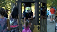 Real-life superheroes hand out candy at Boo at the Zoo firefighter night