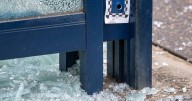 Bullet holes, broken glass after street shooting spree