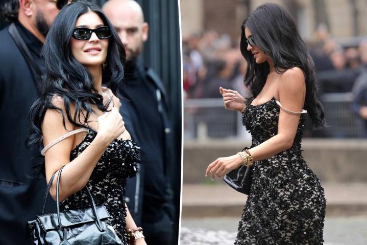 Kylie Jenner exposes bra strap with sheer lace Miu Miu dress during Paris Fashion Week