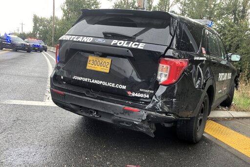 Officer hospitalized after car crashes into police vehicle in North Portland