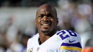 Adrian Peterson remains in jail, charged with DWI, unlawfully carrying a weapon