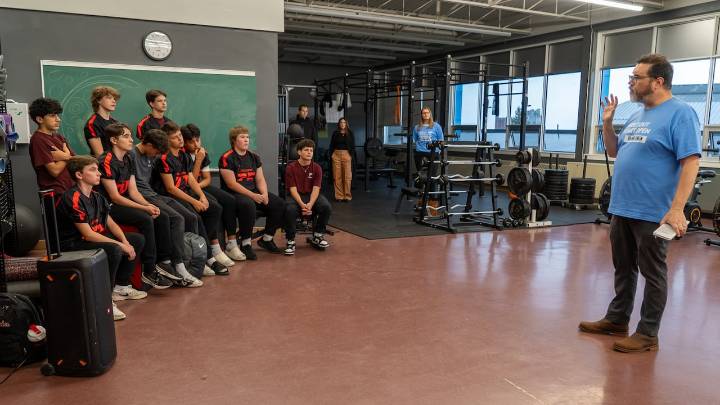 Local high school football team participates in new program: Coaching Boys into Men