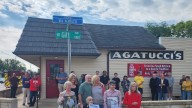 Street sign begins celebrations for a century of a Peoria restaurant