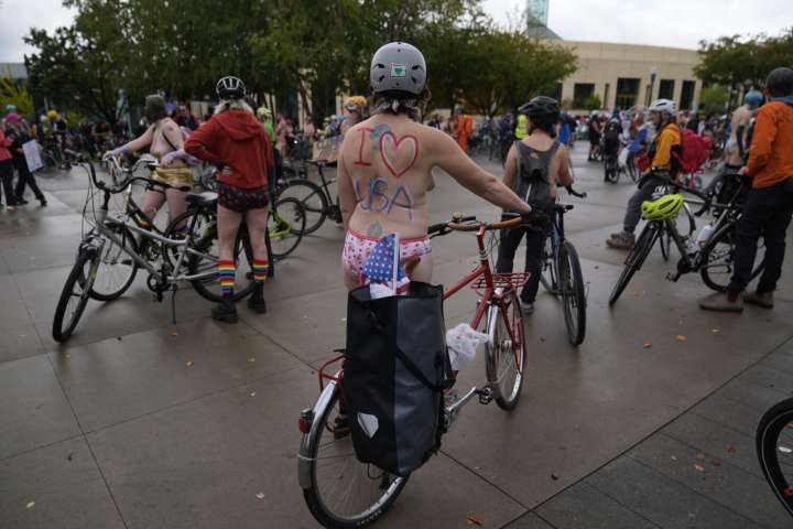 Naked bike riders demonstrate against federal troops in 'quintessentially Portland' protest