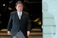 Japan says it plans to tell Trump it will build up military, upgrade security strategy