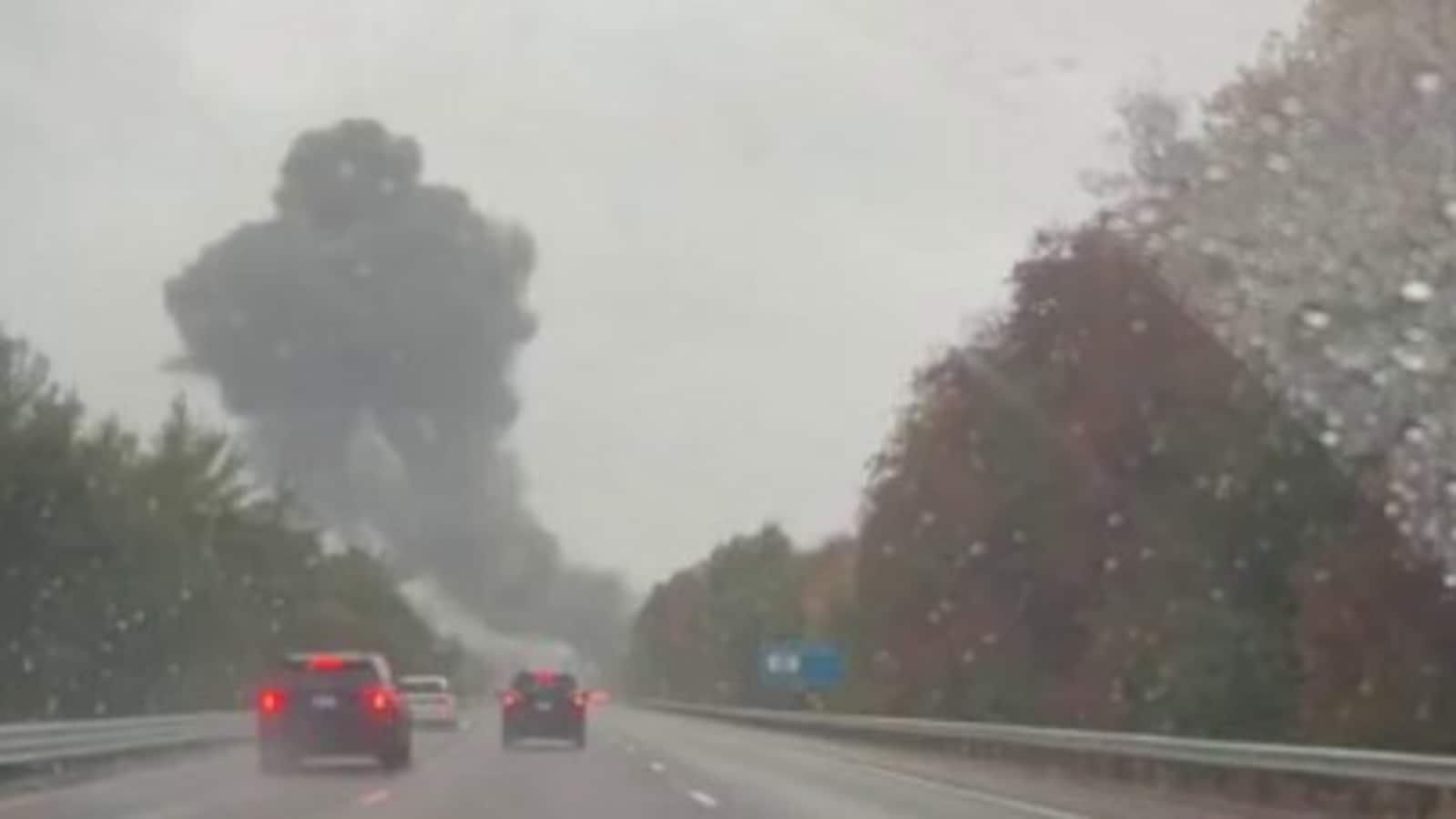 Smoke billows over I-195 after jet crash on a a Massachusetts highway