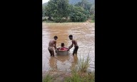 Tribal Odisha’s reality: Man uses ‘cooking pot’ to carry daughter across flooded river sans bridge